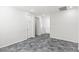Hallway with grey floors and white trim and doors at 127 Medianoche St, Las Vegas, NV 89138
