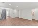 Open living space with hardwood floors, staircase, and plenty of natural light at 127 Medianoche St, Las Vegas, NV 89138