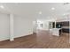 Open-concept living room with hardwood floors and lots of natural light at 127 Medianoche St, Las Vegas, NV 89138