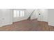 Spacious living room featuring hardwood floors, large windows, and neutral paint at 127 Medianoche St, Las Vegas, NV 89138