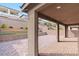 Covered patio with brick pavers and view of terraced landscaping at 127 Medianoche St, Las Vegas, NV 89138