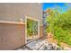 Private backyard view with patio, desert landscaping, and sliding glass door at 137 Desert Pond Ave, Henderson, NV 89002