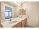 The updated ensuite bathroom offers dual sinks, ample counter space and updated fixtures at 137 Desert Pond Ave, Henderson, NV 89002