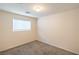 Empty bedroom with neutral carpet, one window, and white walls, ready for personal customization at 137 Desert Pond Ave, Henderson, NV 89002
