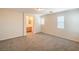 This primary bedroom with neutral carpeting is spacious and bright at 137 Desert Pond Ave, Henderson, NV 89002