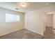 This bedroom features neutral walls and carpet and includes a standard closet and access to the hallway at 137 Desert Pond Ave, Henderson, NV 89002