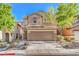 Inviting two-story home with a well-maintained front yard and a two-car garage at 137 Desert Pond Ave, Henderson, NV 89002