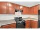 Cozy kitchen features upper and lower cabinets and a black gas burning range at 137 Desert Pond Ave, Henderson, NV 89002