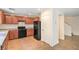 Compact kitchen with dark appliances, dark cabinets and tile flooring at 137 Desert Pond Ave, Henderson, NV 89002