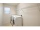 This functional laundry room includes a modern washer and dryer and convenient wire shelving at 137 Desert Pond Ave, Henderson, NV 89002