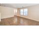 Neutral living room with tile flooring, windows, and convenient access to other rooms at 137 Desert Pond Ave, Henderson, NV 89002