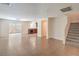 Spacious open-concept living area with tile floors flowing into an adjacent kitchen at 137 Desert Pond Ave, Henderson, NV 89002