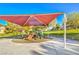Community playground with slides and climbing structures under shade cover, enhancing outdoor fun in a private property at 137 Desert Pond Ave, Henderson, NV 89002