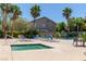 Relaxing community pool and hot tub area with poolside lounge chairs and lush landscaping for a resort-style experience at 137 Desert Pond Ave, Henderson, NV 89002
