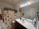 Cozy bathroom showcasing a vanity and shower/bath with an interesting curtain, creating a relaxing space at 141 Gryffin Ave, Las Vegas, NV 89123