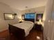 Bedroom with hardwood floors, neutral walls, and two matching night stands at 141 Gryffin Ave, Las Vegas, NV 89123