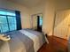 Bedroom featuring a window with dark curtains and a mirrored closet at 141 Gryffin Ave, Las Vegas, NV 89123
