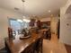 Bright dining area with a large window, stainless appliances, and wood cabinetry at 141 Gryffin Ave, Las Vegas, NV 89123
