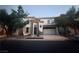 Attractive two-story home featuring stone accents, a two-car garage, and well-maintained landscaping at 141 Gryffin Ave, Las Vegas, NV 89123