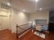 Bright loft area featuring hardwood floors and a study desk with natural lighting for work or relaxation at 141 Gryffin Ave, Las Vegas, NV 89123