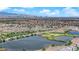 Aerial view of the neighborhood with community lakes and the cityscape in the distance at 1525 Spiced Wine Ave # 10102, Henderson, NV 89074