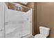 Bathroom featuring a glass-enclosed shower and a toilet with a neutral color palette at 1525 Spiced Wine Ave # 10102, Henderson, NV 89074