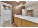 Bathroom features a double sink vanity, neutral color scheme, and a view of the bedroom at 1525 Spiced Wine Ave # 10102, Henderson, NV 89074