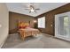 Bedroom with a queen-sized bed, ceiling fan, and private access to the outdoor area at 1525 Spiced Wine Ave # 10102, Henderson, NV 89074