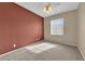 Bedroom showcasing neutral walls, plush carpet, and a ceiling fan at 1525 Spiced Wine Ave # 10102, Henderson, NV 89074
