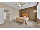 A secondary bedroom with plush carpeting, a ceiling fan, and natural light at 1525 Spiced Wine Ave # 10102, Henderson, NV 89074