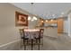 Dining area with a table, chandelier, and kitchen view at 1525 Spiced Wine Ave # 10102, Henderson, NV 89074