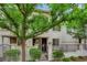 Townhouse exterior showcasing a gated front yard with lush landscaping at 1525 Spiced Wine Ave # 10102, Henderson, NV 89074