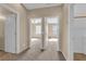 Hallway showcasing neutral paint, plush carpet, and views to multiple bedrooms at 1525 Spiced Wine Ave # 10102, Henderson, NV 89074
