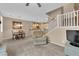 Open-concept living room with a dining area and staircase at 1525 Spiced Wine Ave # 10102, Henderson, NV 89074
