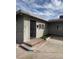 A covered entrance includes steps and dark storm door for added security at 1651 Cadillac Ln, Las Vegas, NV 89106