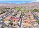 Aerial view of the community showcasing many homes, desert landscaping, and mountain views at 173 Calm Morning Ave, Henderson, NV 89002