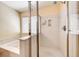 Bright bathroom featuring a shower with glass doors and a soaking tub with a wide ledge at 173 Calm Morning Ave, Henderson, NV 89002