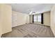 Comfortable carpeted bedroom with a ceiling fan and natural light at 173 Calm Morning Ave, Henderson, NV 89002