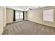 Spacious bedroom with a ceiling fan, carpeted floors, and two windows providing ample natural light at 173 Calm Morning Ave, Henderson, NV 89002
