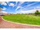 Well-manicured green space with mountain views and gravel walkway at 173 Calm Morning Ave, Henderson, NV 89002