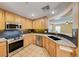 Modern kitchen featuring granite countertops, stainless steel appliances, and ample cabinet space at 173 Calm Morning Ave, Henderson, NV 89002