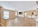 Spacious living room with tile flooring, ceiling fan, and built-in storage cabinets at 173 Calm Morning Ave, Henderson, NV 89002