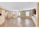 Open-concept living area featuring neutral walls, tile flooring, and ample natural light from windows at 173 Calm Morning Ave, Henderson, NV 89002