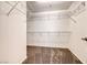 Walk-in closet providing ample storage space with multiple wire racks and carpet flooring at 173 Calm Morning Ave, Henderson, NV 89002