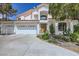 Stunning two-story home with a three-car garage, beautiful landscaping, and a grand entrance at 176 Tierra Bonita Ct, Henderson, NV 89074