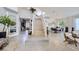 Bright foyer boasts modern staircase, high ceilings, sleek floors, and views to living and dining areas at 176 Tierra Bonita Ct, Henderson, NV 89074