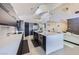 Open-concept kitchen boasting a large island, modern appliances, and sleek countertops at 176 Tierra Bonita Ct, Henderson, NV 89074