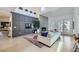 Cozy living room featuring a fireplace, plush sofa, and access to a patio at 176 Tierra Bonita Ct, Henderson, NV 89074