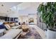 Open-concept living area with a kitchen view, stylish decor, and high ceilings at 176 Tierra Bonita Ct, Henderson, NV 89074