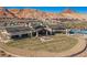 Expansive backyard with desert landscaping and an elegant modern home with mountain views at 19 Desert Ivy Ln, Henderson, NV 89011